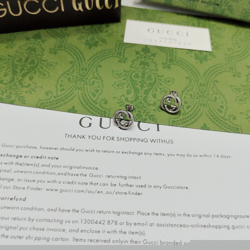 G*u*i earrings